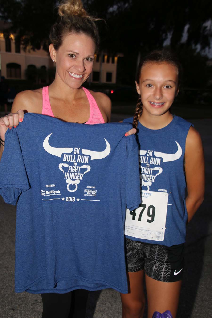 Runners holding Bull Run shirts
