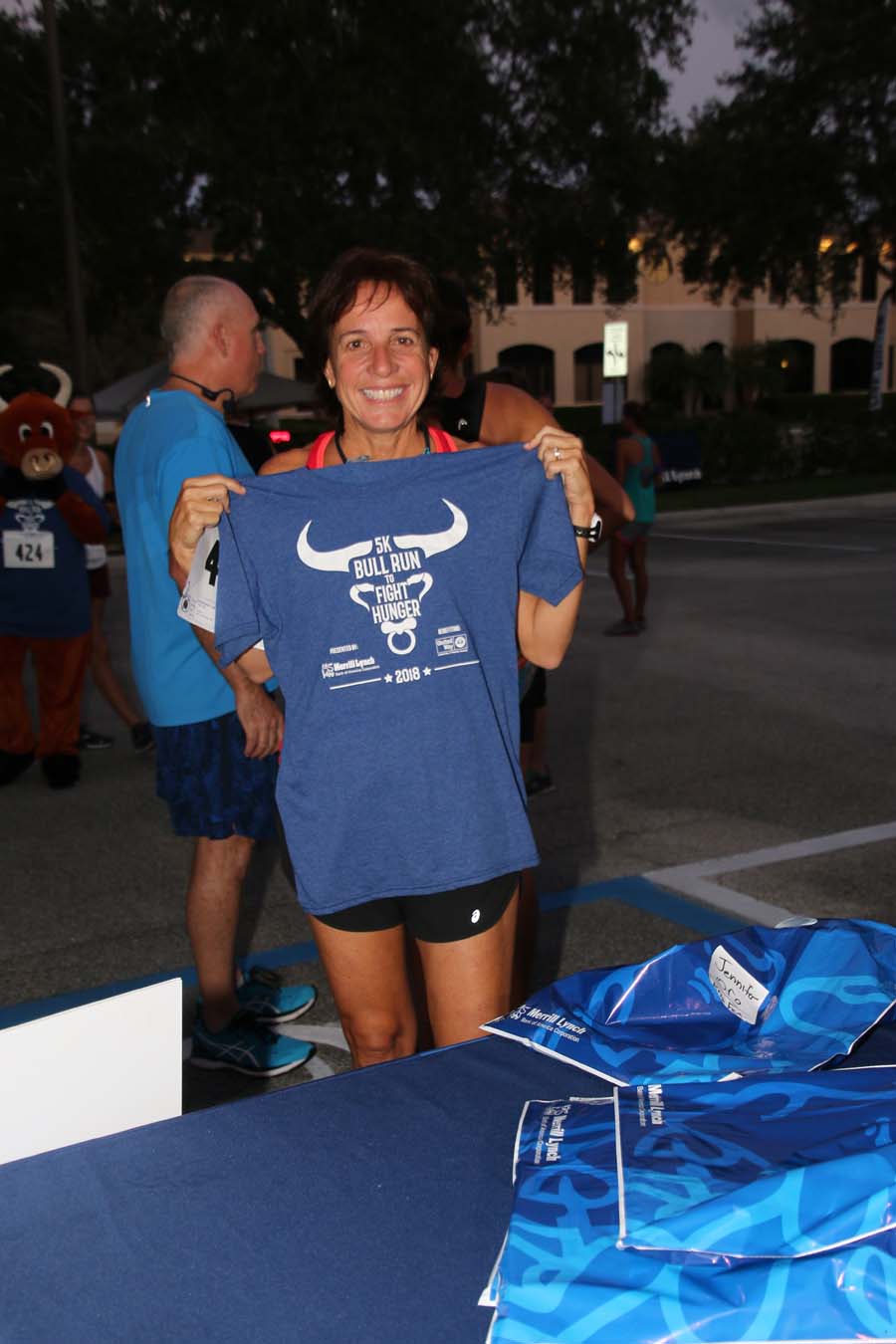 Volunteer holding Bull Run shirt