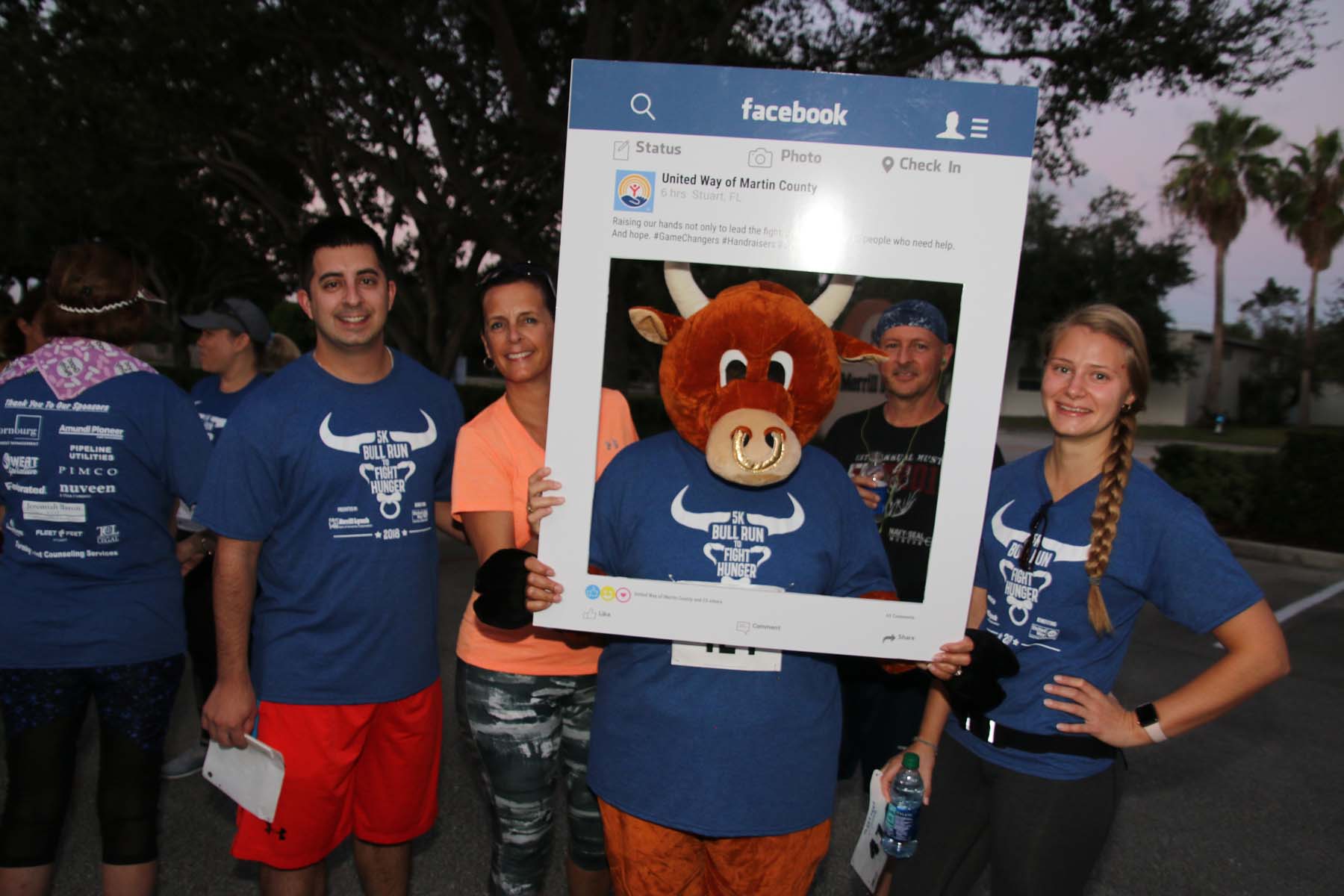 Volunteers 'frame' bull mascot